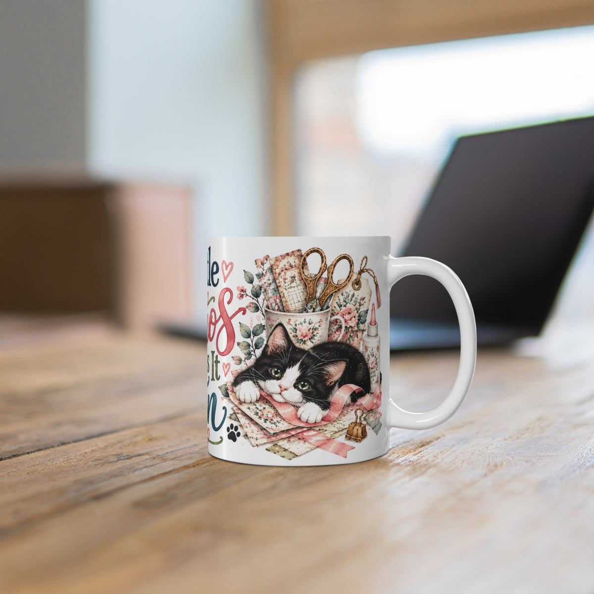 A Little Chaos Makes It Fun tuxedo cat ceramic mug on a wooden desk