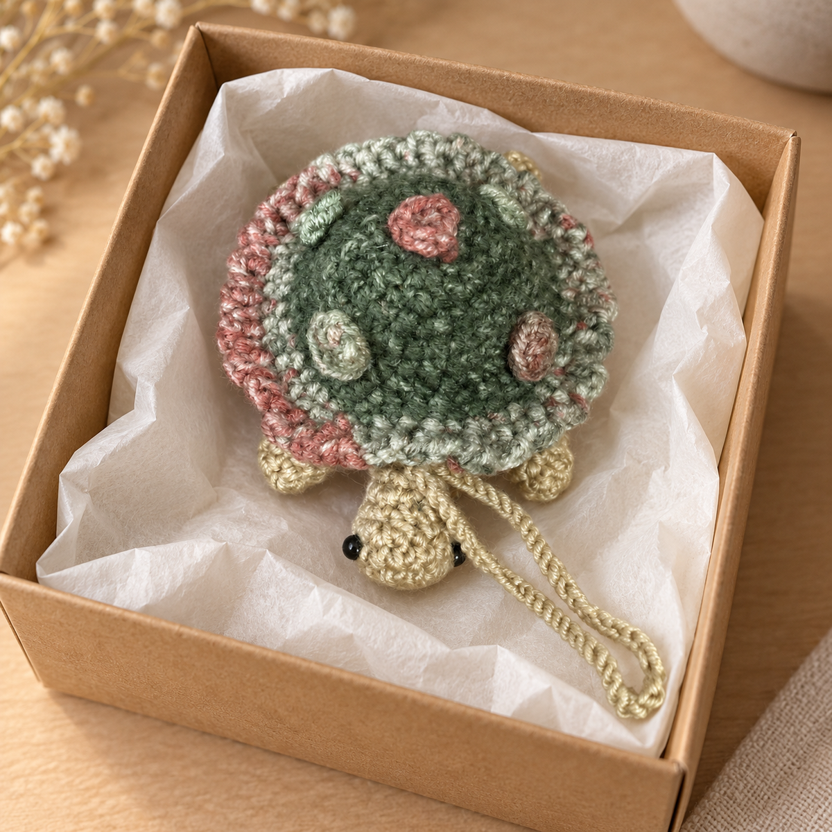 Sage crochet turtle pocket mirror charm in a kraft gift box