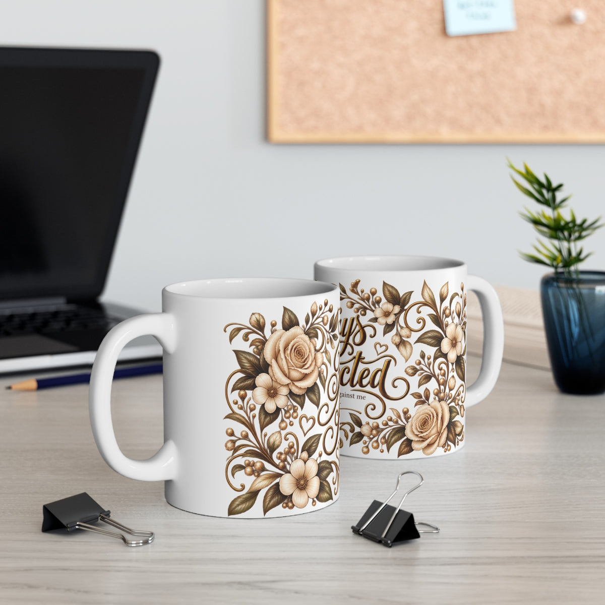 Always Protected Isaiah 54:17 ceramic mug shown from two angles on a desk