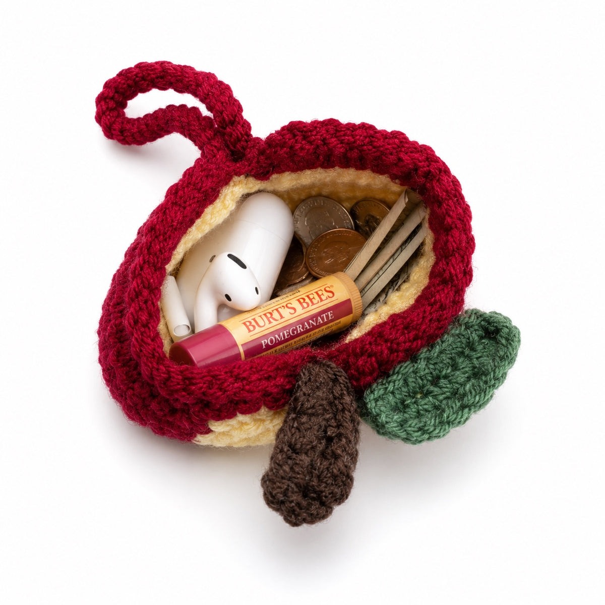 Open crochet apple mini pouch holding small everyday essentials