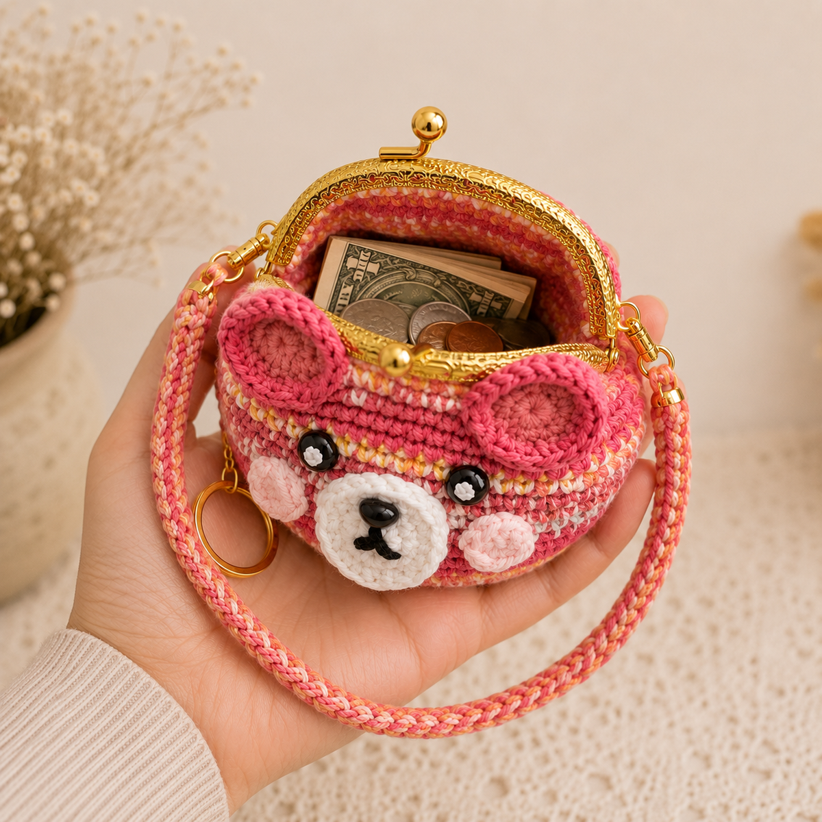 Open crochet bear coin purse showing unlined crochet interior with folded cash and coins