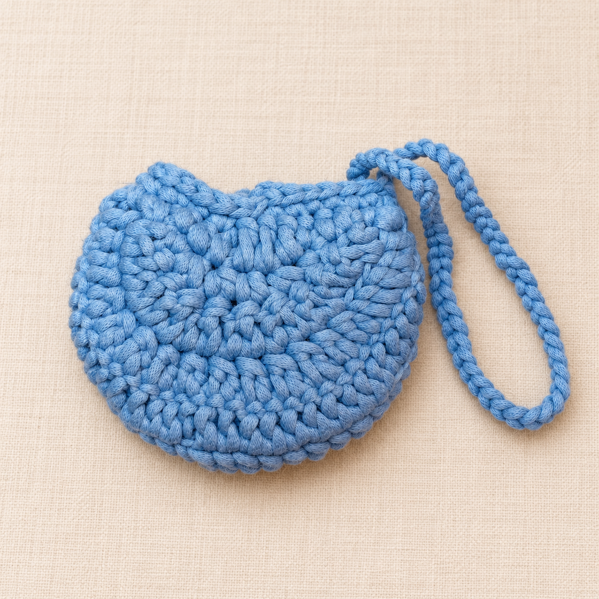 Blue flower button crochet wristlet pouch back view