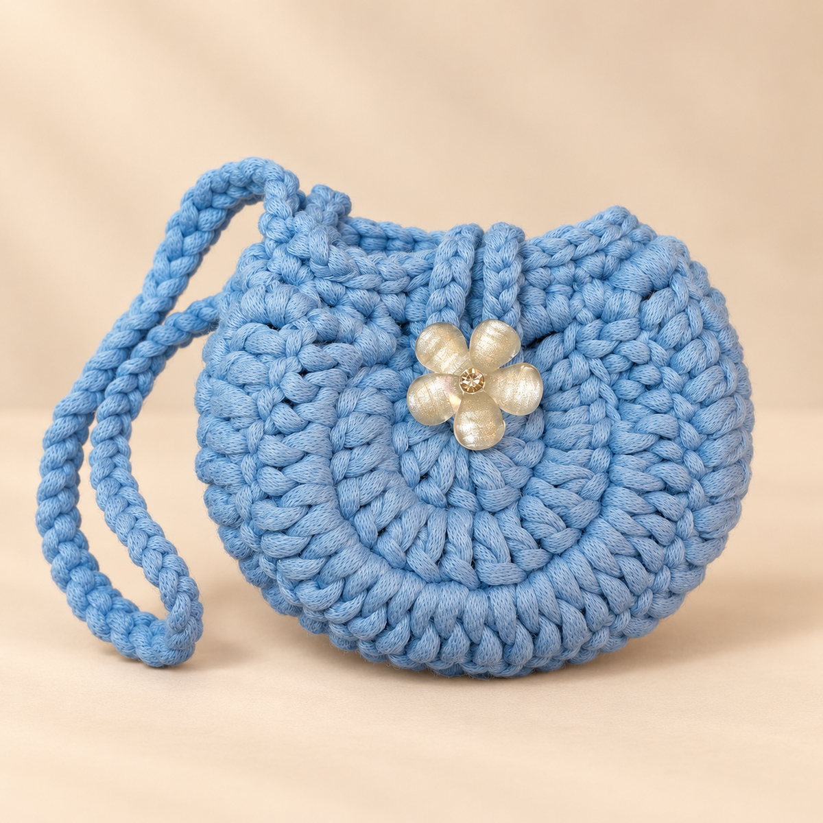 Blue flower button crochet wristlet pouch front view