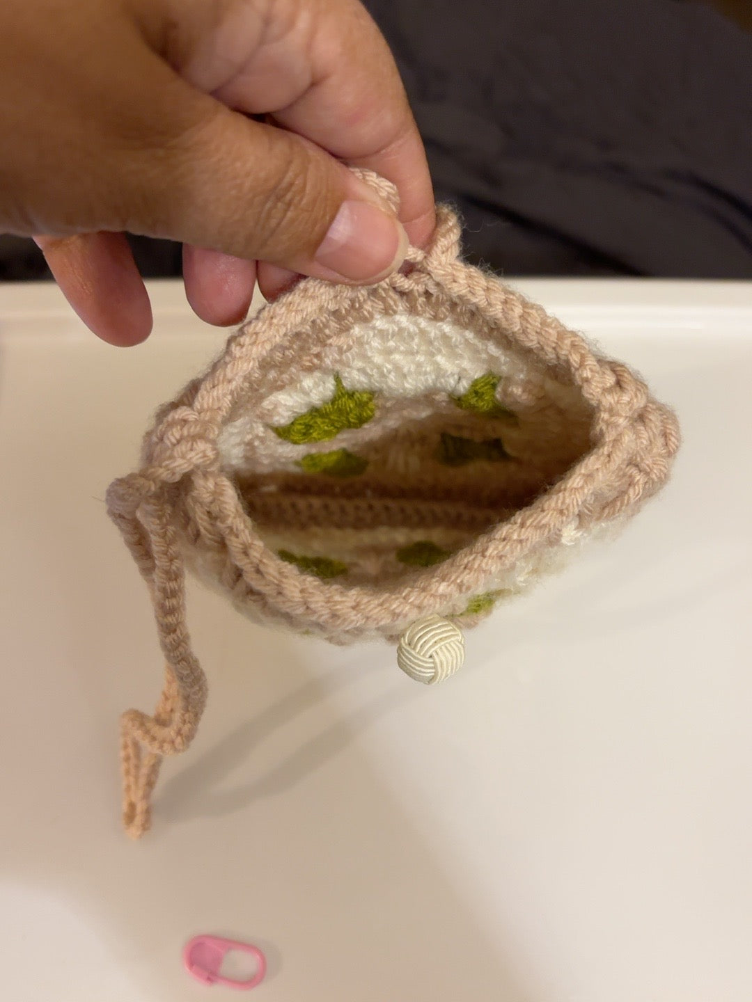 Interior view of handmade blush floral crochet pouch