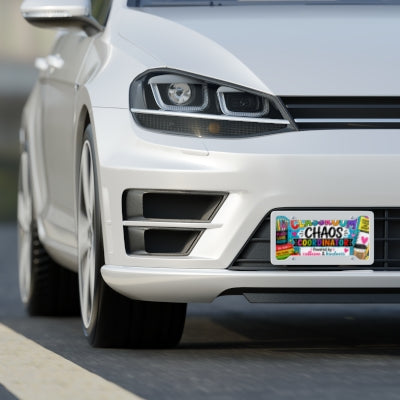 Classroom Chaos Coordinator teacher license plate shown on front of white car