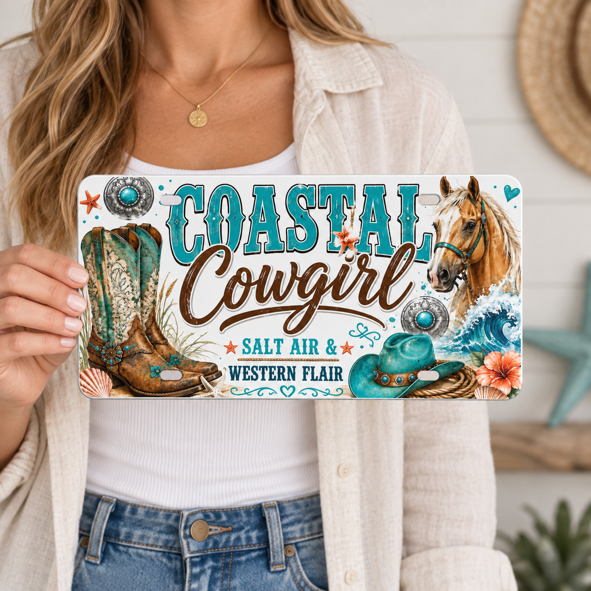Person holding Coastal Cowgirl decorative license plate for 12 by 6 inch size reference