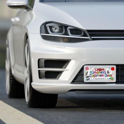 Coffee Kindness and Classroom Chaos teacher license plate shown on front of white car