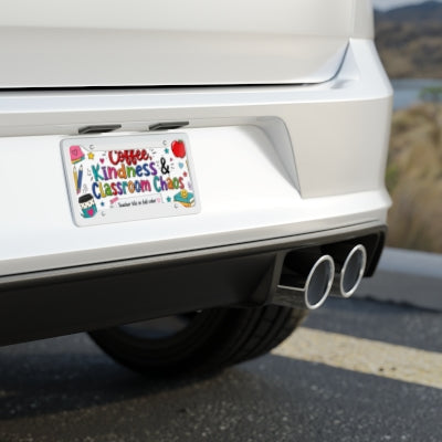 Coffee Kindness and Classroom Chaos teacher license plate shown on rear of white car