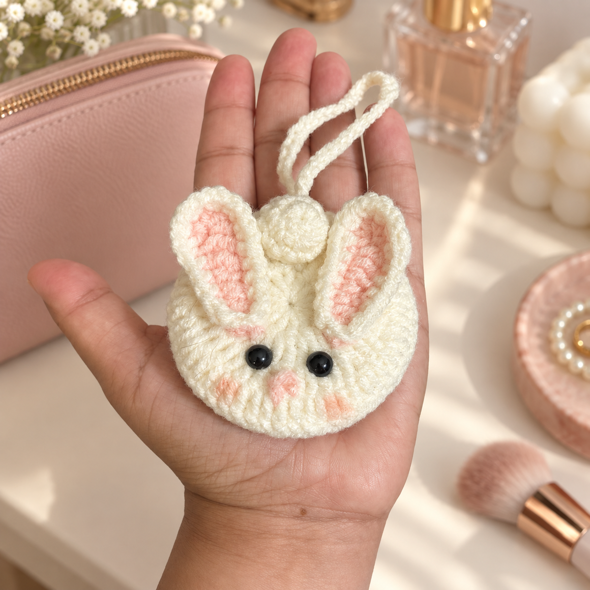 Cream bunny crochet pocket mirror shown in hand for size reference