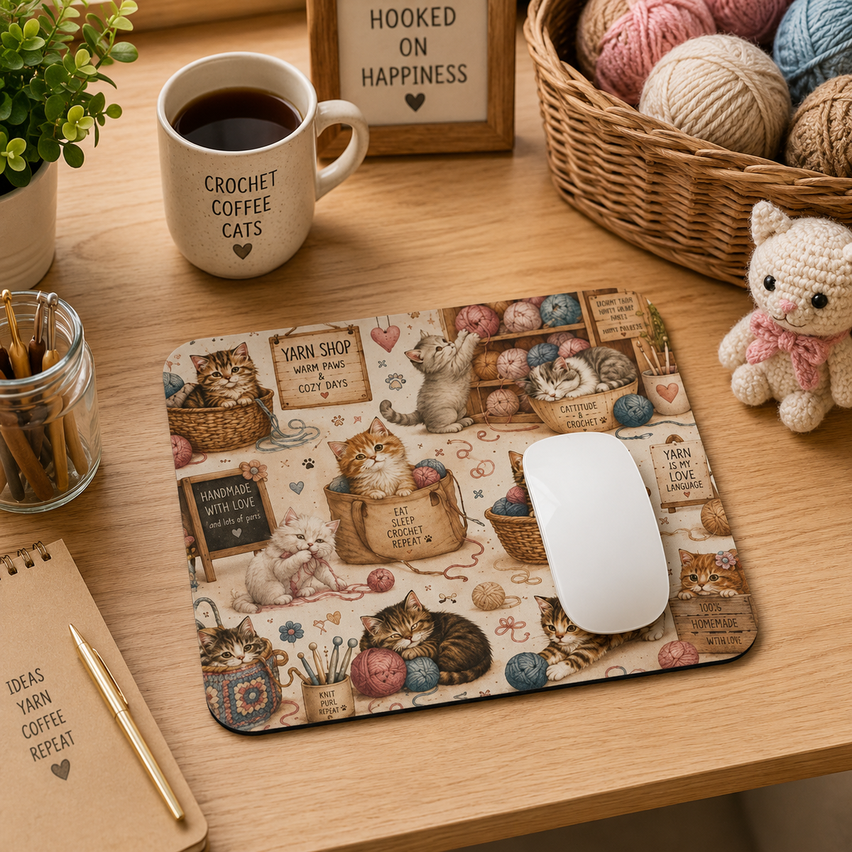 Crochet cats mouse pad styled on a cozy craft desk with yarn and coffee