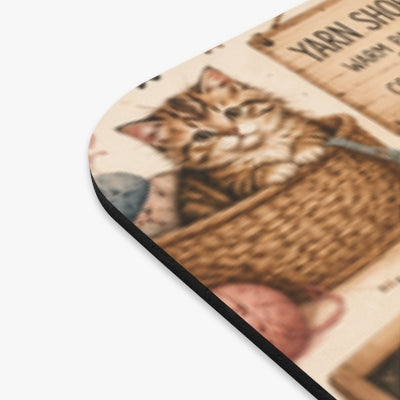 Close-up detail of crochet cats mouse pad print and black edge