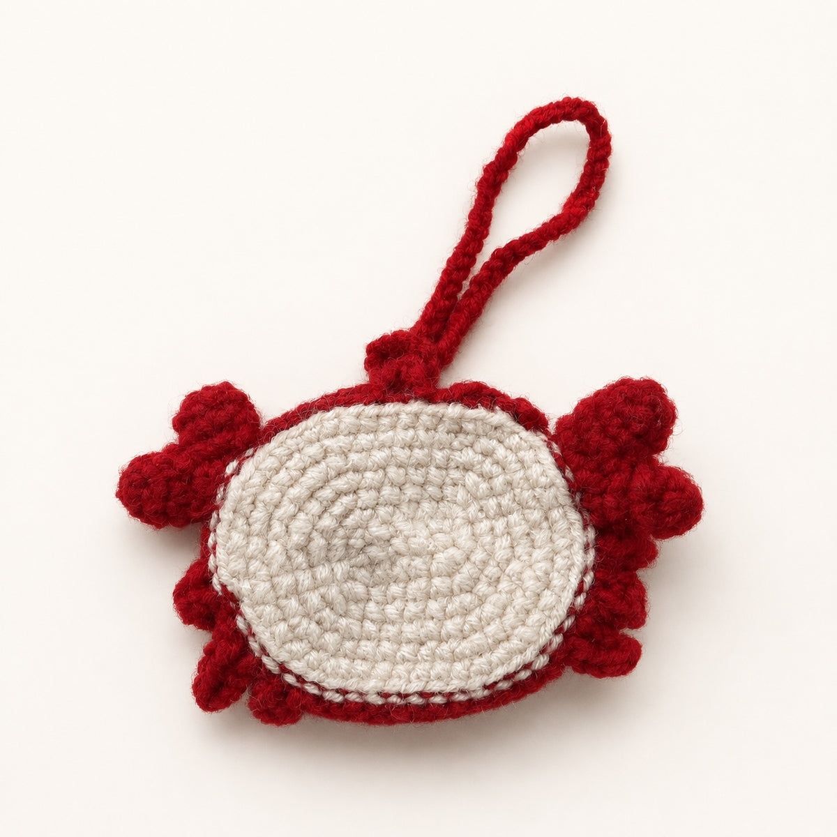 Handmade red crochet crab mini pouch back view
