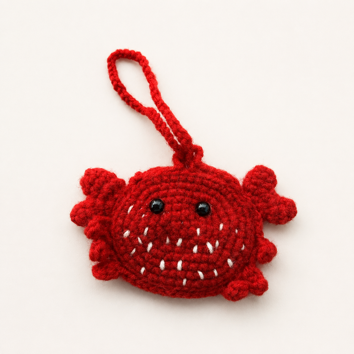 Handmade red crochet crab mini pouch front view