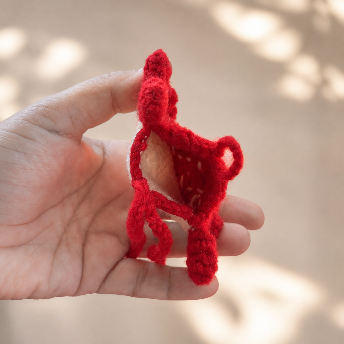 Open handmade crochet crab mini pouch showing empty interior