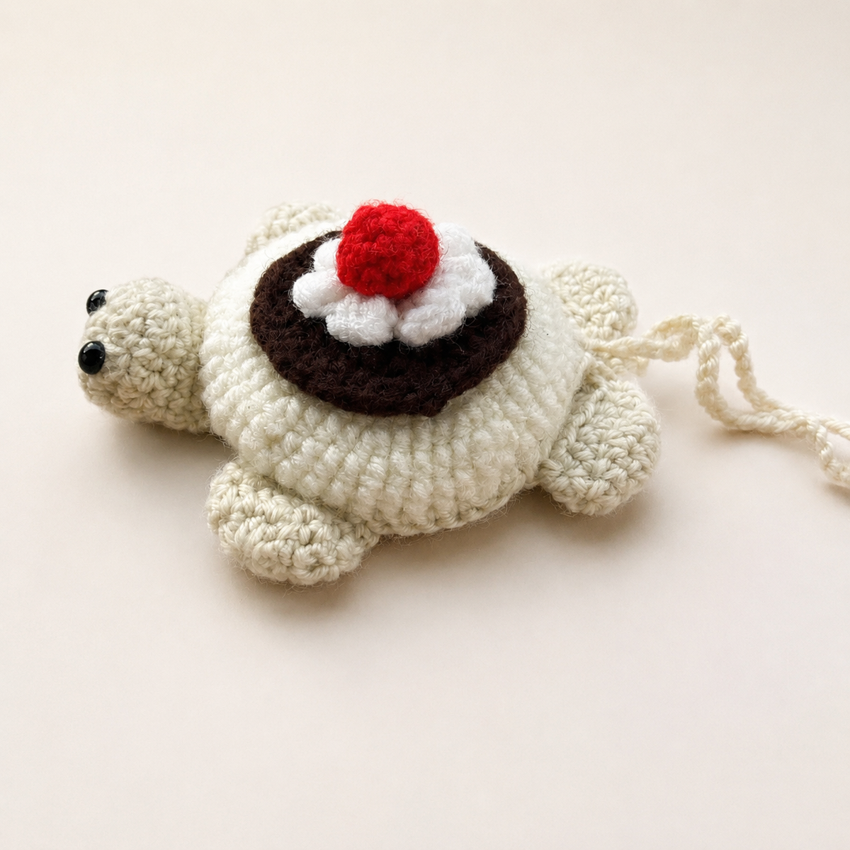 Angled detail of crochet dessert turtle pouch