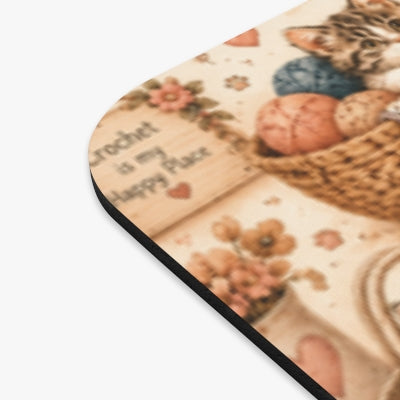 Close-up detail of crochet kittens mouse pad print and black edge