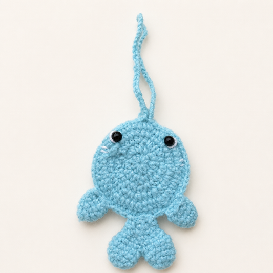 Handmade turquoise crochet whale pouch front view