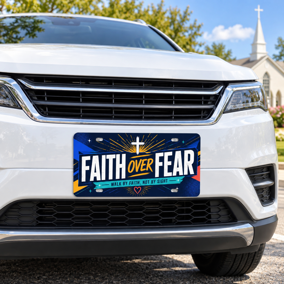 Faith Over Fear Christian decorative license plate mounted on a white car near a church