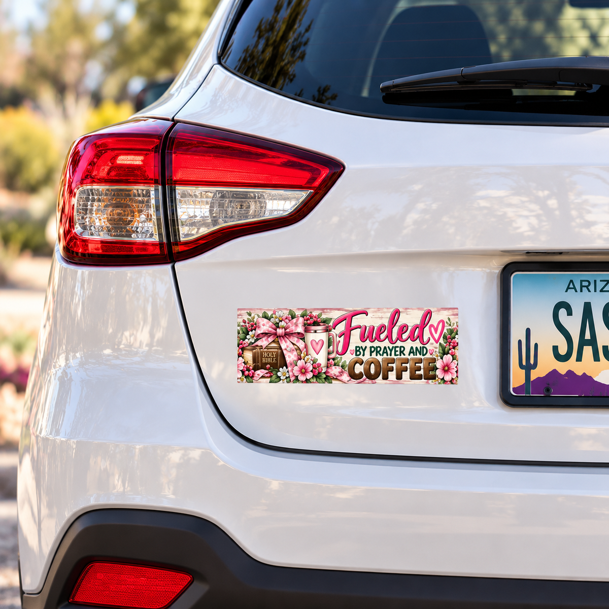 11 by 3 inch bumper sticker on white compact SUV