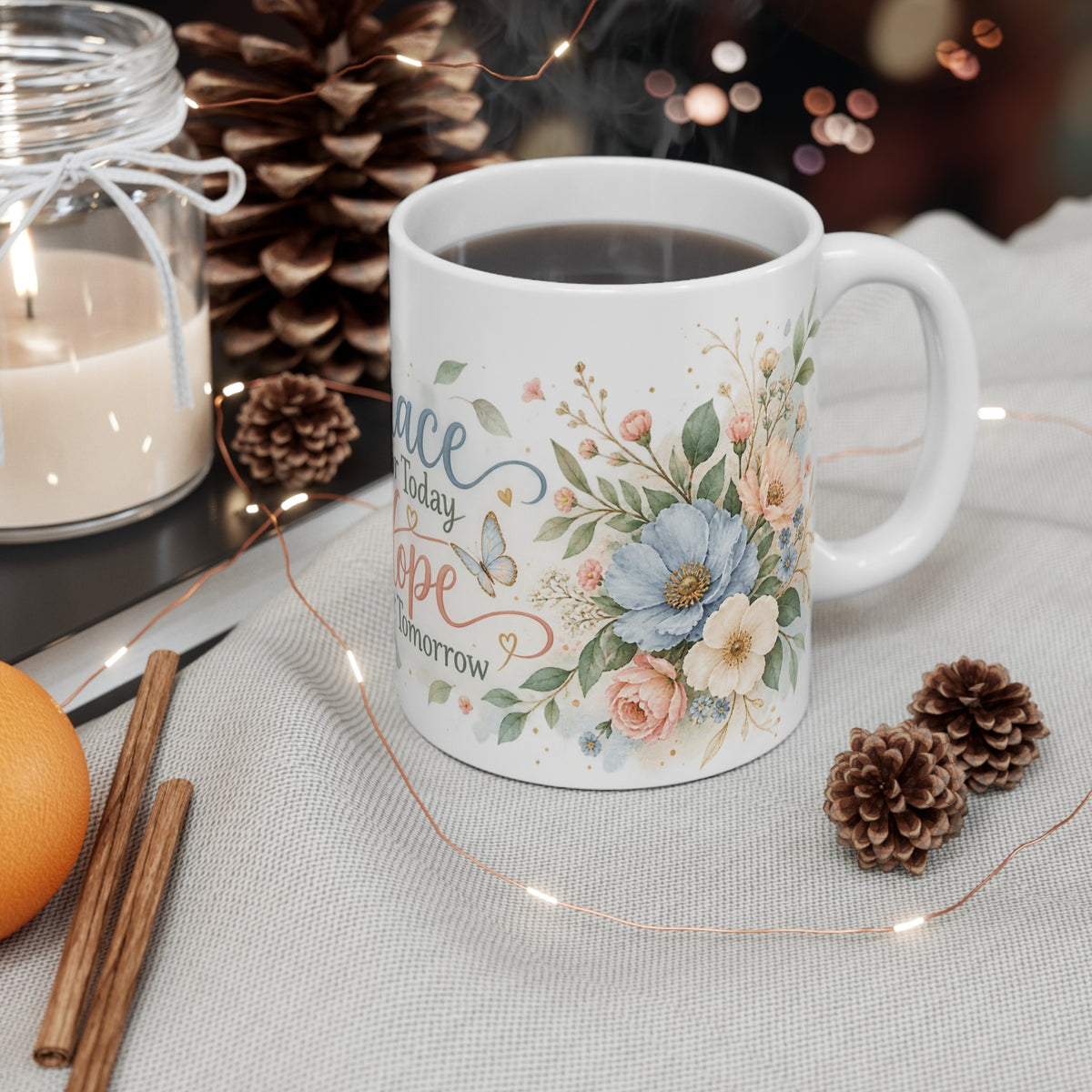 Grace for Today Hope for Tomorrow floral ceramic mug styled with candle and pinecones