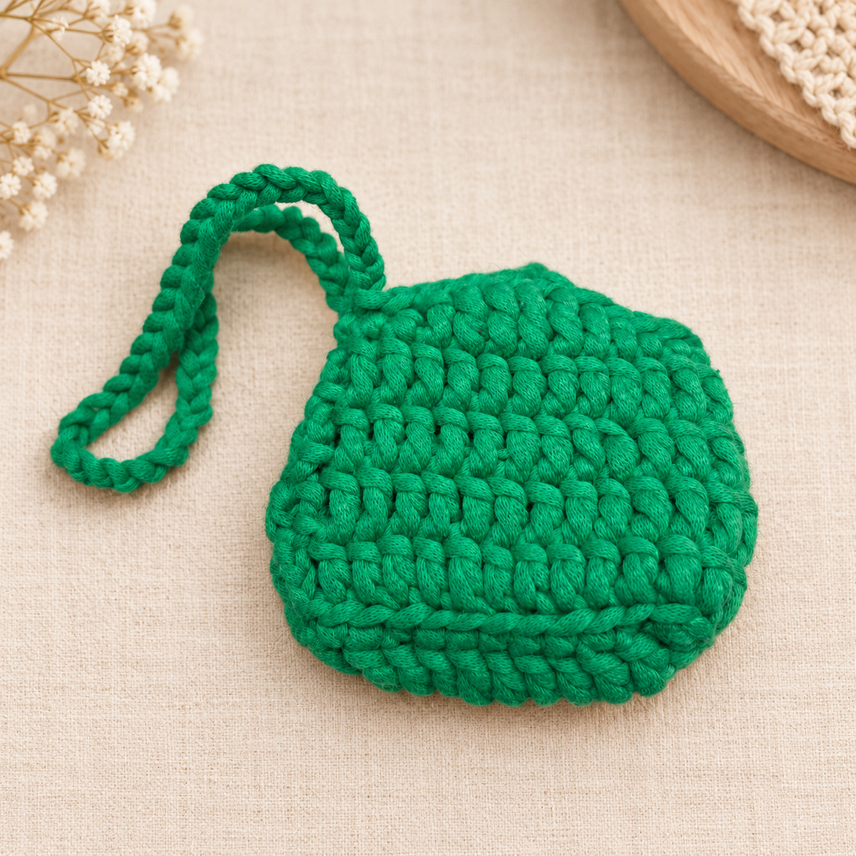 Green flower button crochet wristlet pouch back view