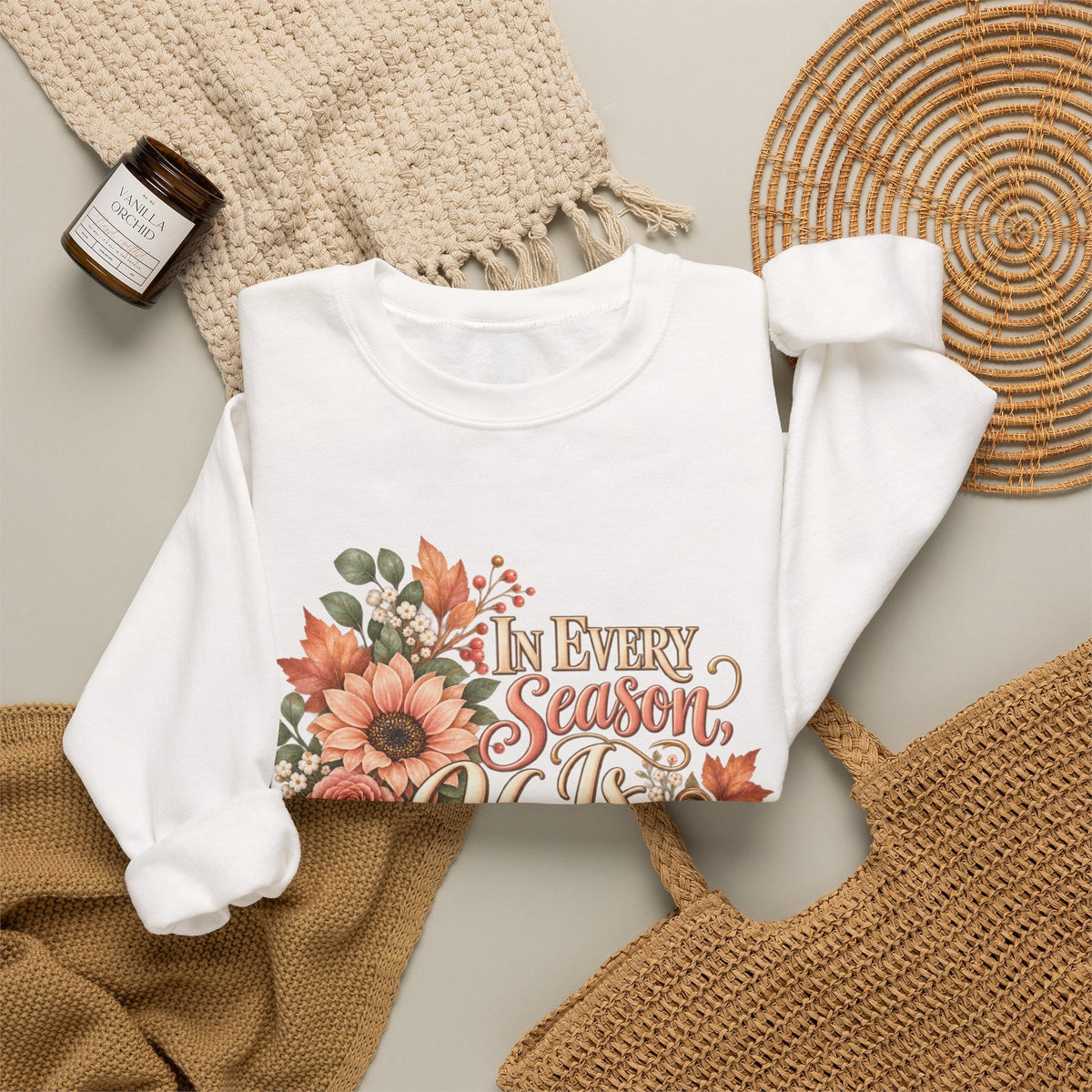 In Every Season He Is Faithful sweatshirt folded in white