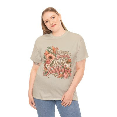 Woman wearing the In Every Season He’s Faithful Christian floral T-shirt in sand