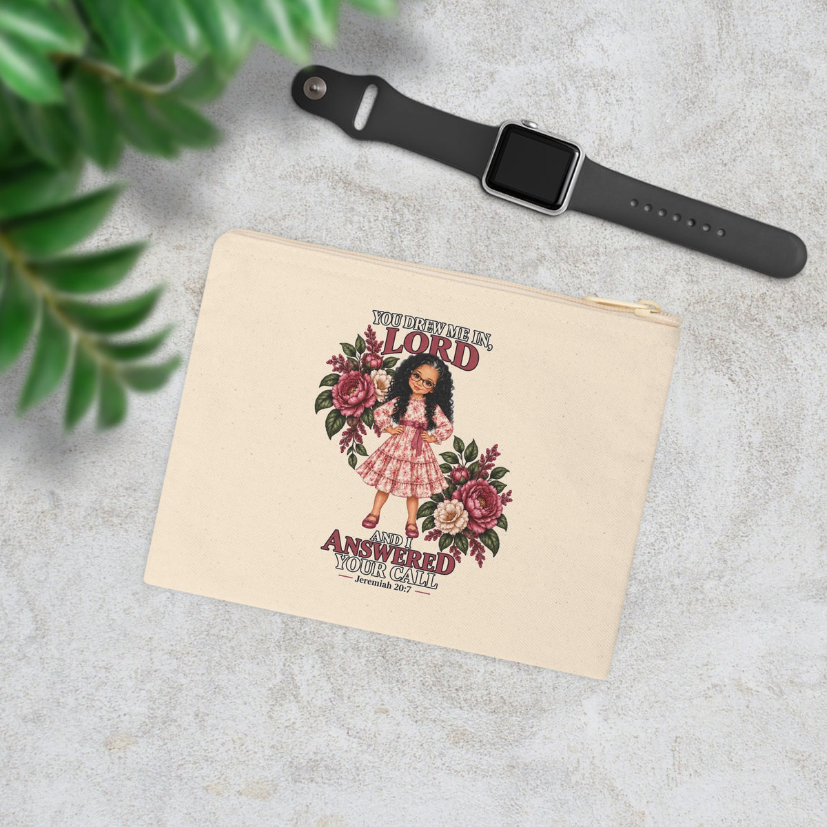 Christian canvas pouch with Jeremiah 20:7 design in lifestyle flat lay