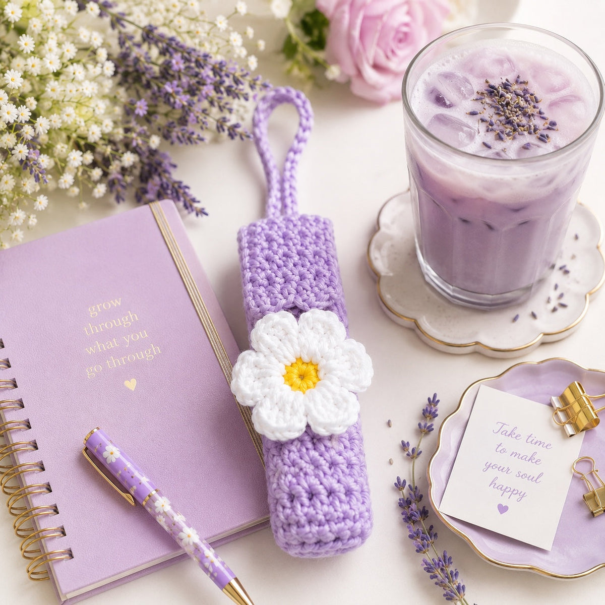Lavender Daisy handmade crochet lip gloss holder lifestyle flat lay