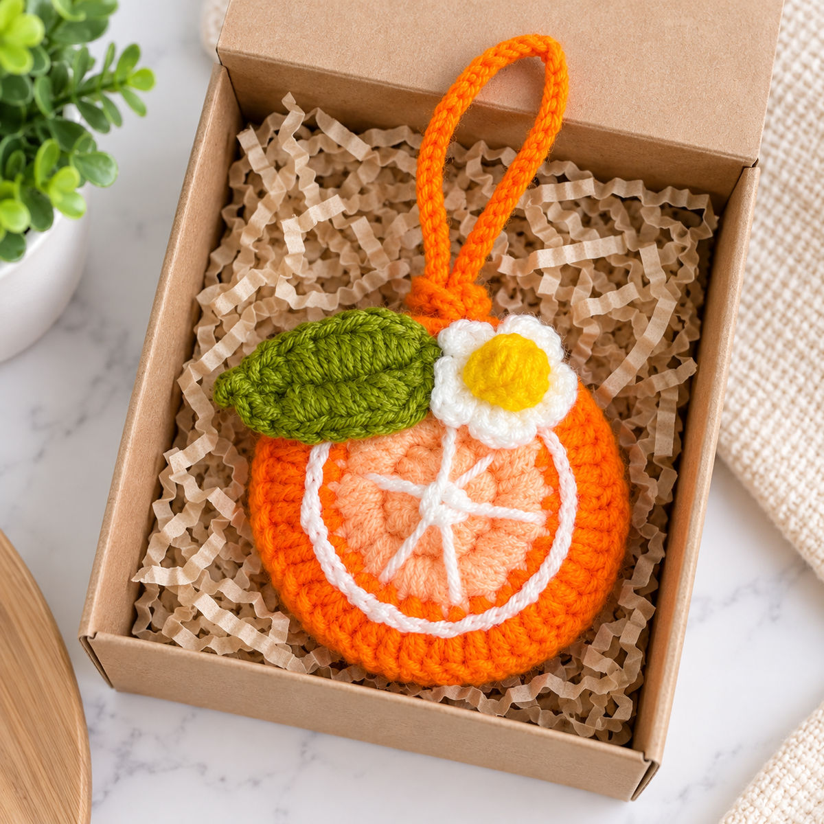 Orange crochet mini pouch in gift presentation