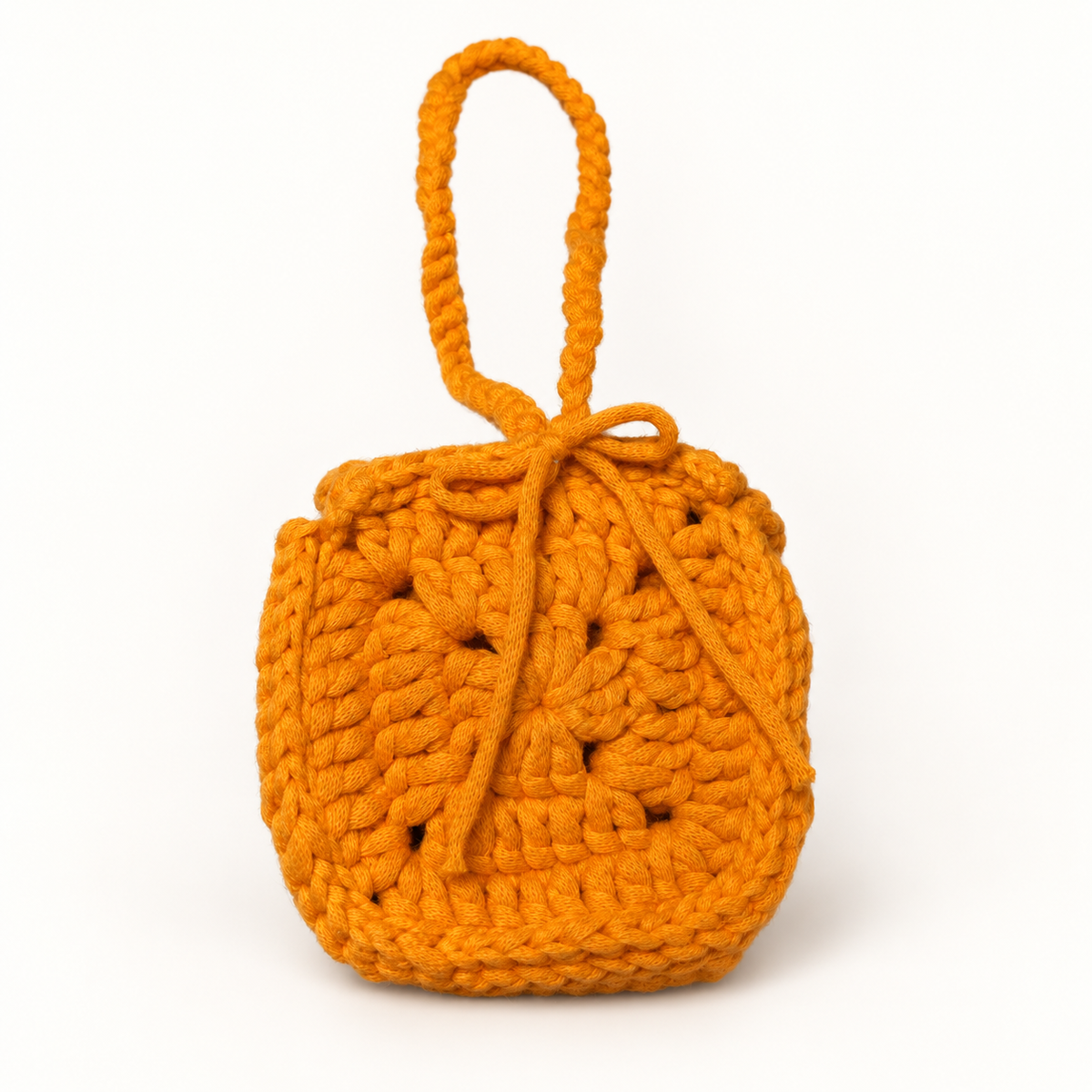Bright orange handmade crochet mini wristlet pouch back view