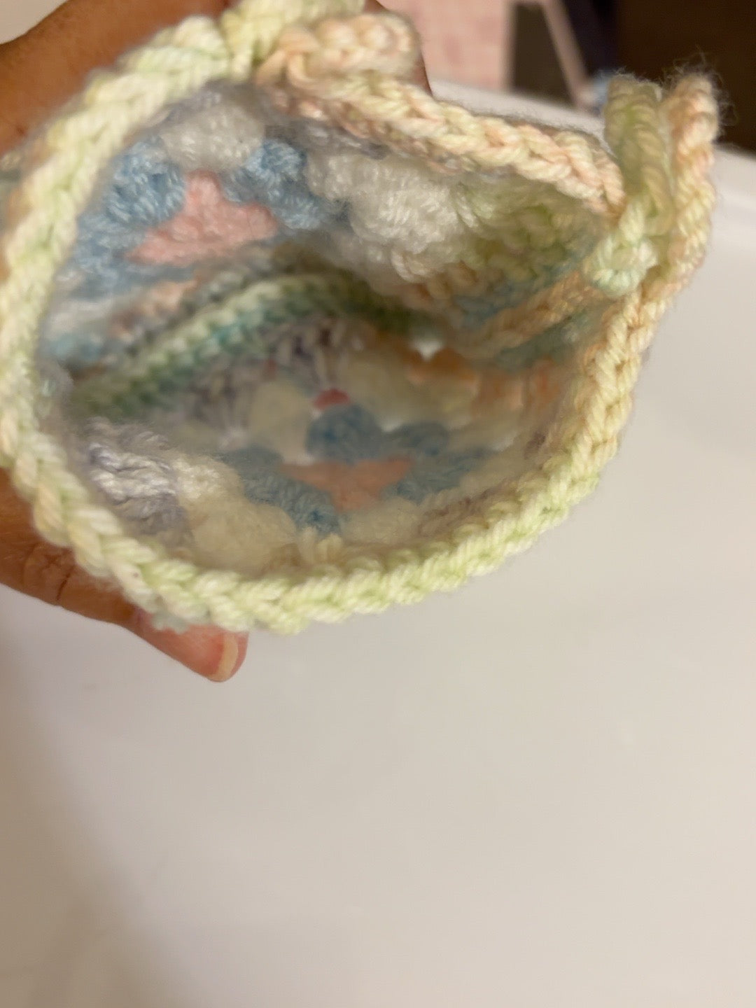Interior view of handmade pastel crochet pouch
