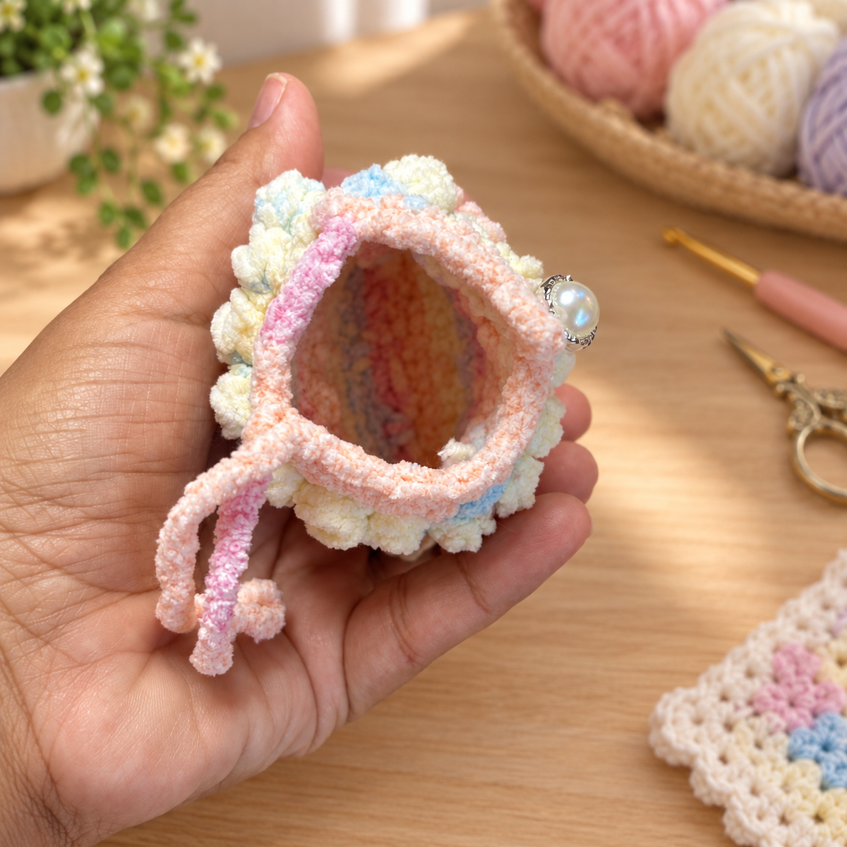 Empty unlined interior of pastel ruffle crochet mini pouch