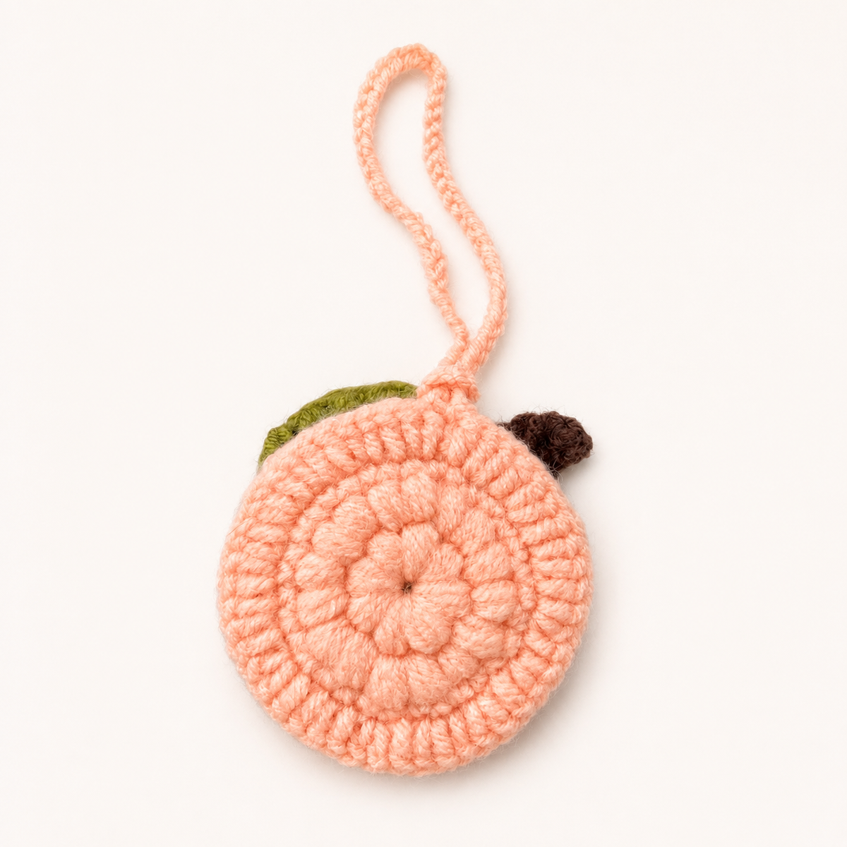 Back view of handmade crochet peach mini pouch