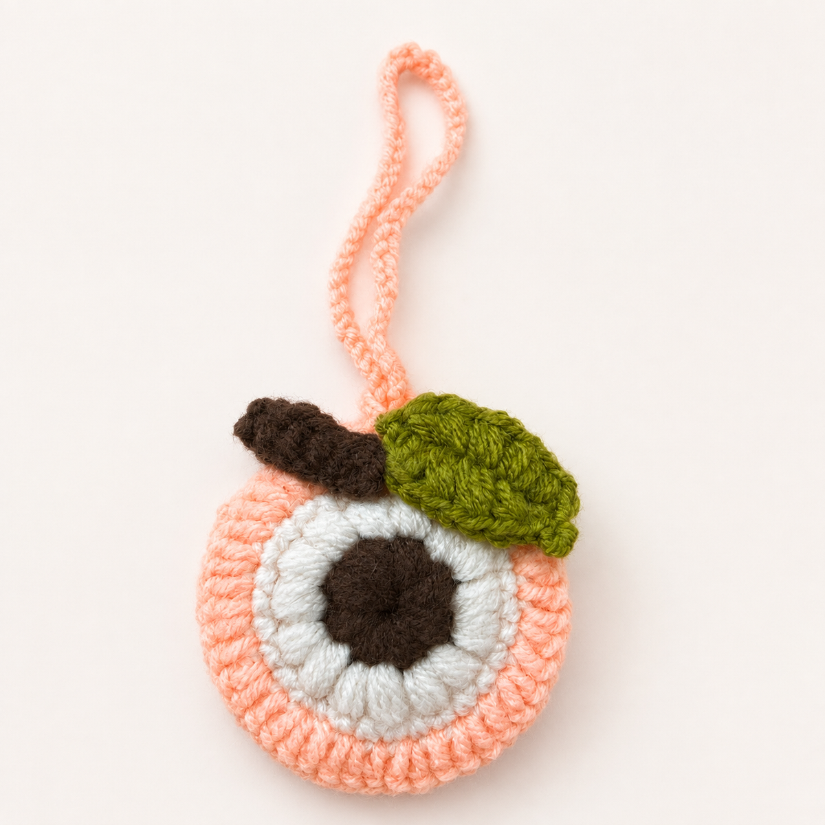 Handmade crochet peach mini pouch front view with hanging cord