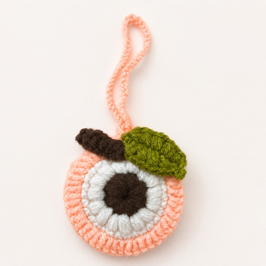 Handmade crochet peach mini pouch front view with hanging cord