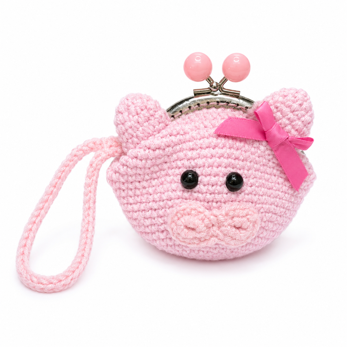 Handmade crochet pink pig coin purse with kiss-lock clasp, bow, and wrist strap