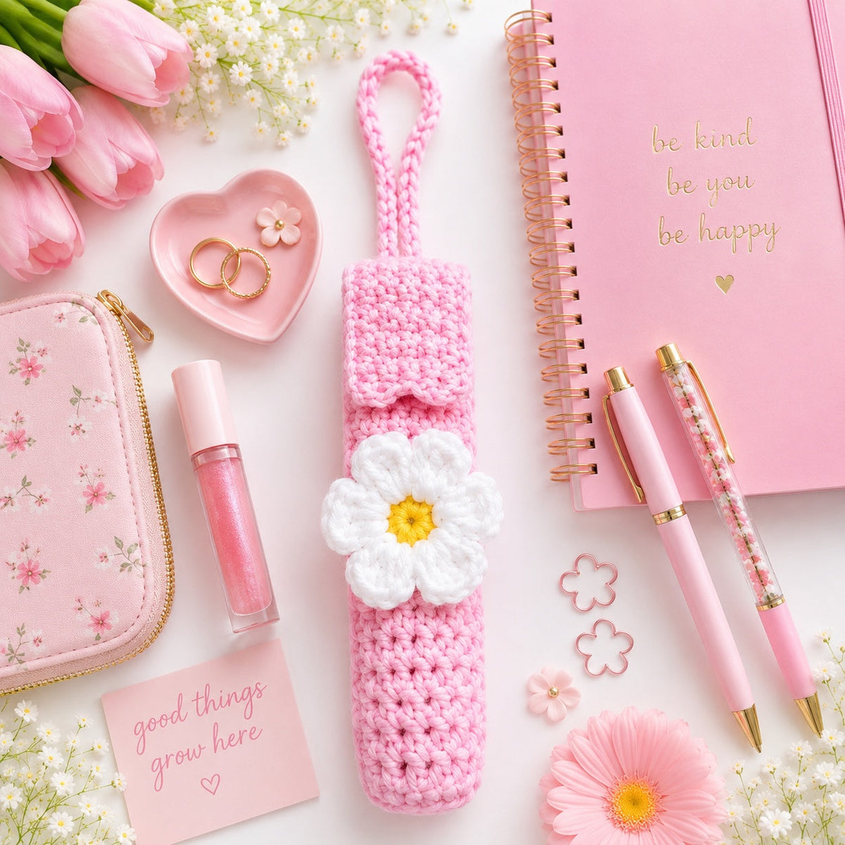 Pink Daisy handmade crochet lip gloss holder lifestyle flat lay