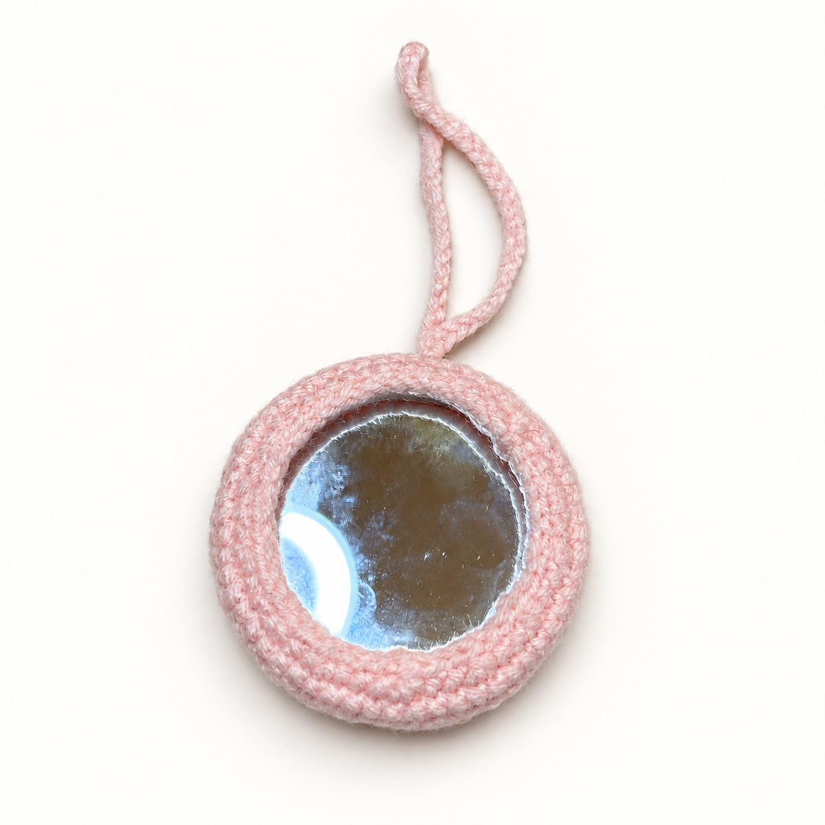 Handmade pink pig crochet pocket mirror showing mirror side