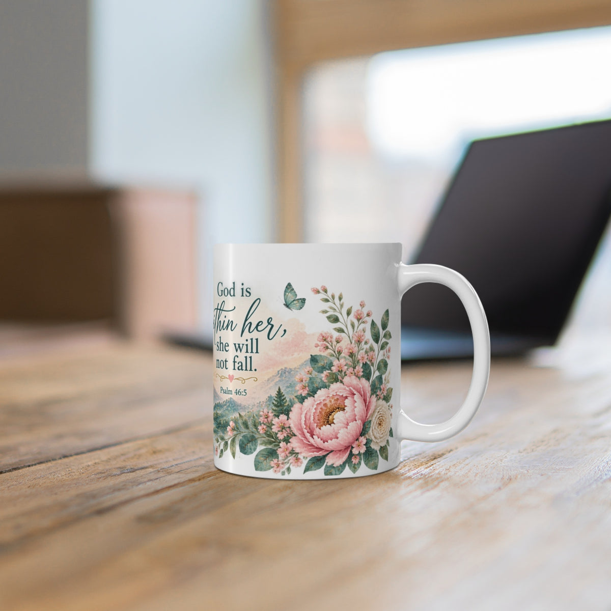 Floral faith mug on wooden desk
