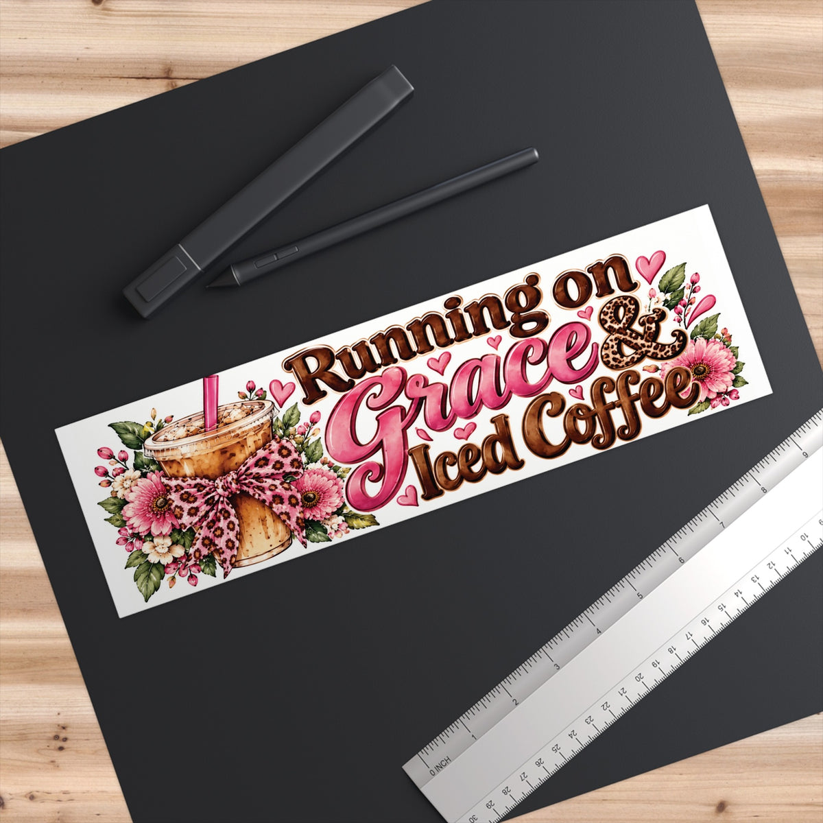 Bumper sticker flat lay on black desk with ruler