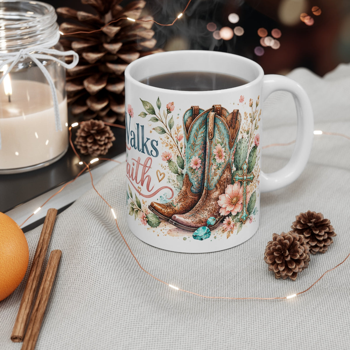 She Walks by Faith western watercolor ceramic mug styled with candle and pinecones
