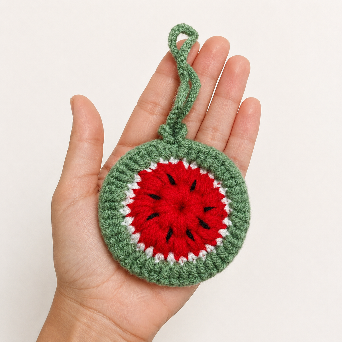 Palm-sized handmade crochet watermelon mini pouch