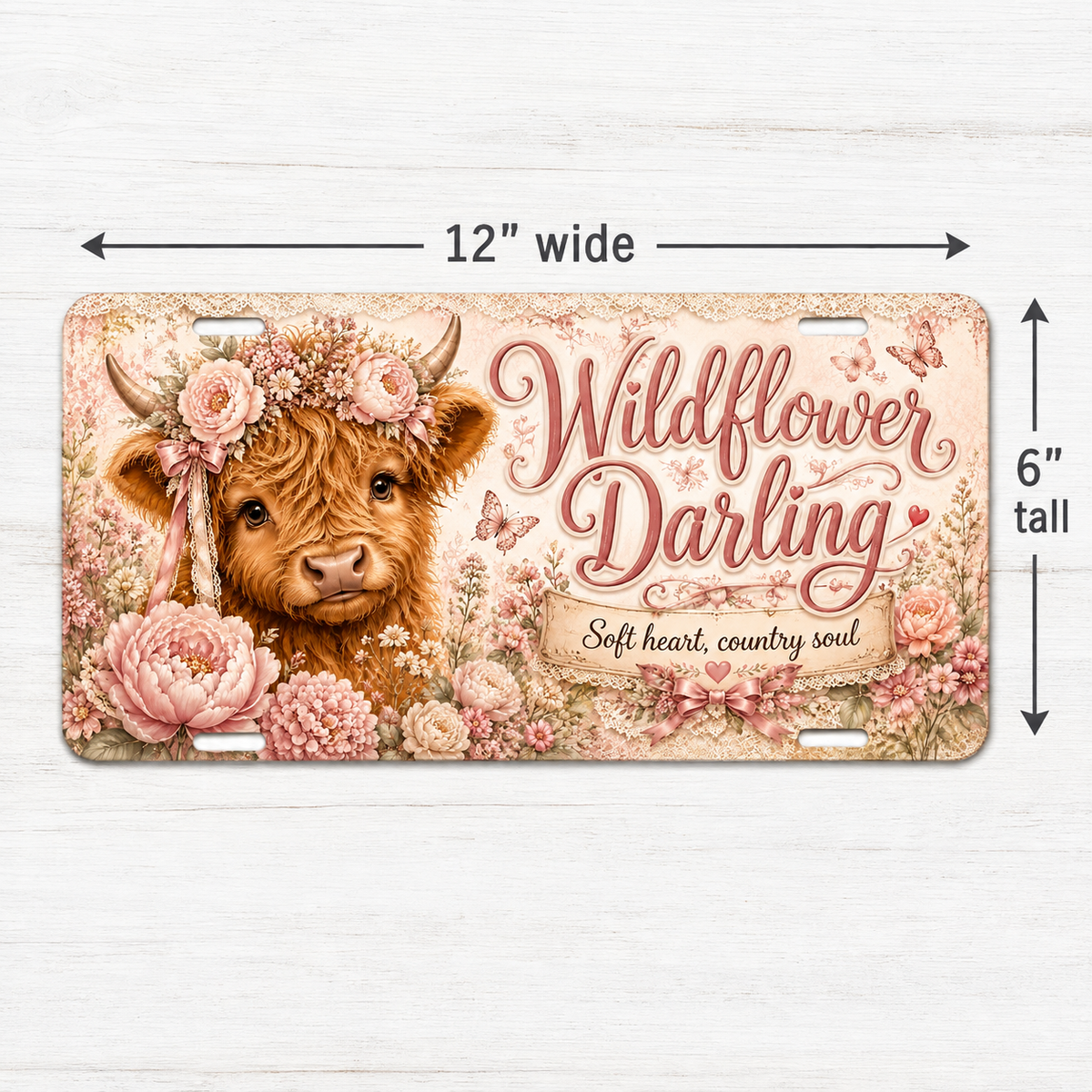Wildflower Darling decorative Highland cow license plate shown at 12 by 6 inch size